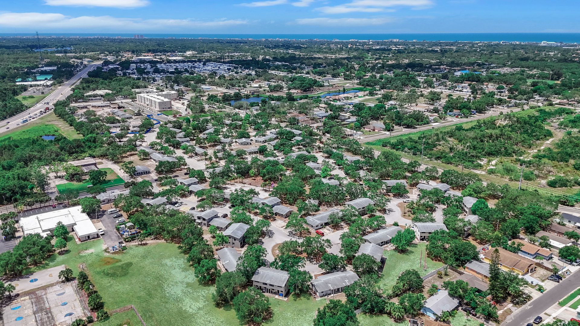 Rainbow Village Complex Aerial with Gulf(1)